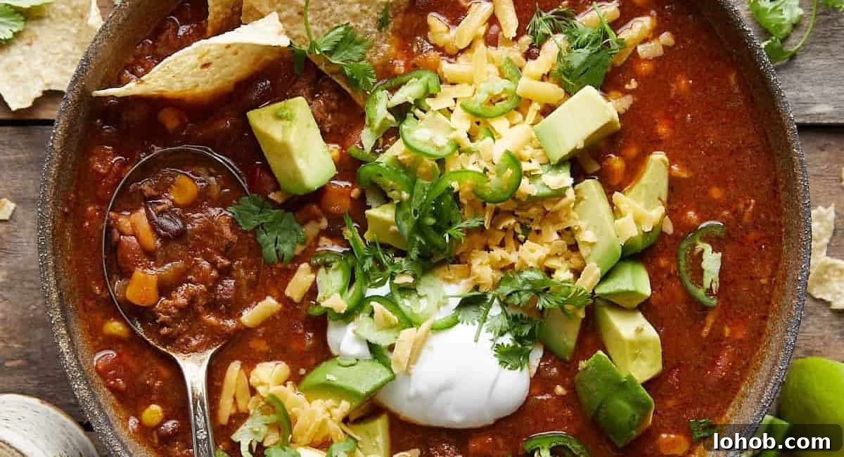 Overhead image of 7 can taco soup with garnish.