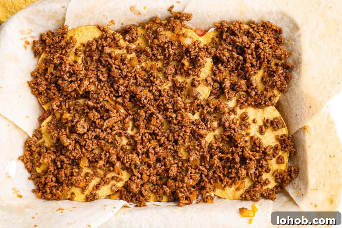 Seasoned ground beef layered over the top of the tostada shells.