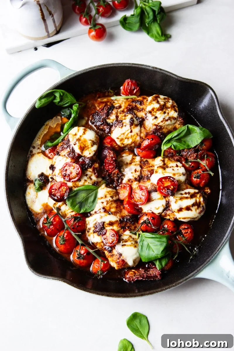 Sun-Dried Tomato Chicken Caprese Recipe with Balsamic Glaze 2 Cast iron skillet with balsamic glazed chicken, tomatoes, fresh mozzarella and basil.