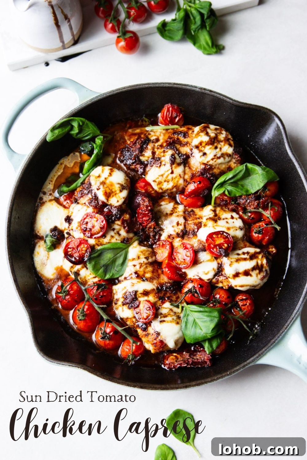 Sun-Dried Tomato Chicken Caprese Recipe with Balsamic Glaze 16 Cast iron skillet with balsamic glazed chicken, tomatoes, fresh mozzarella and basil.