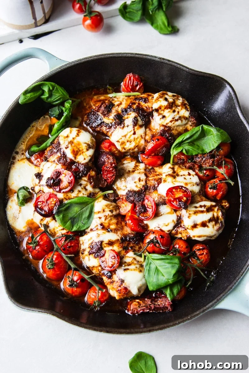 Sun-Dried Tomato Chicken Caprese Recipe with Balsamic Glaze 9 Cast iron skillet with balsamic glazed chicken, tomatoes, fresh mozzarella and basil.