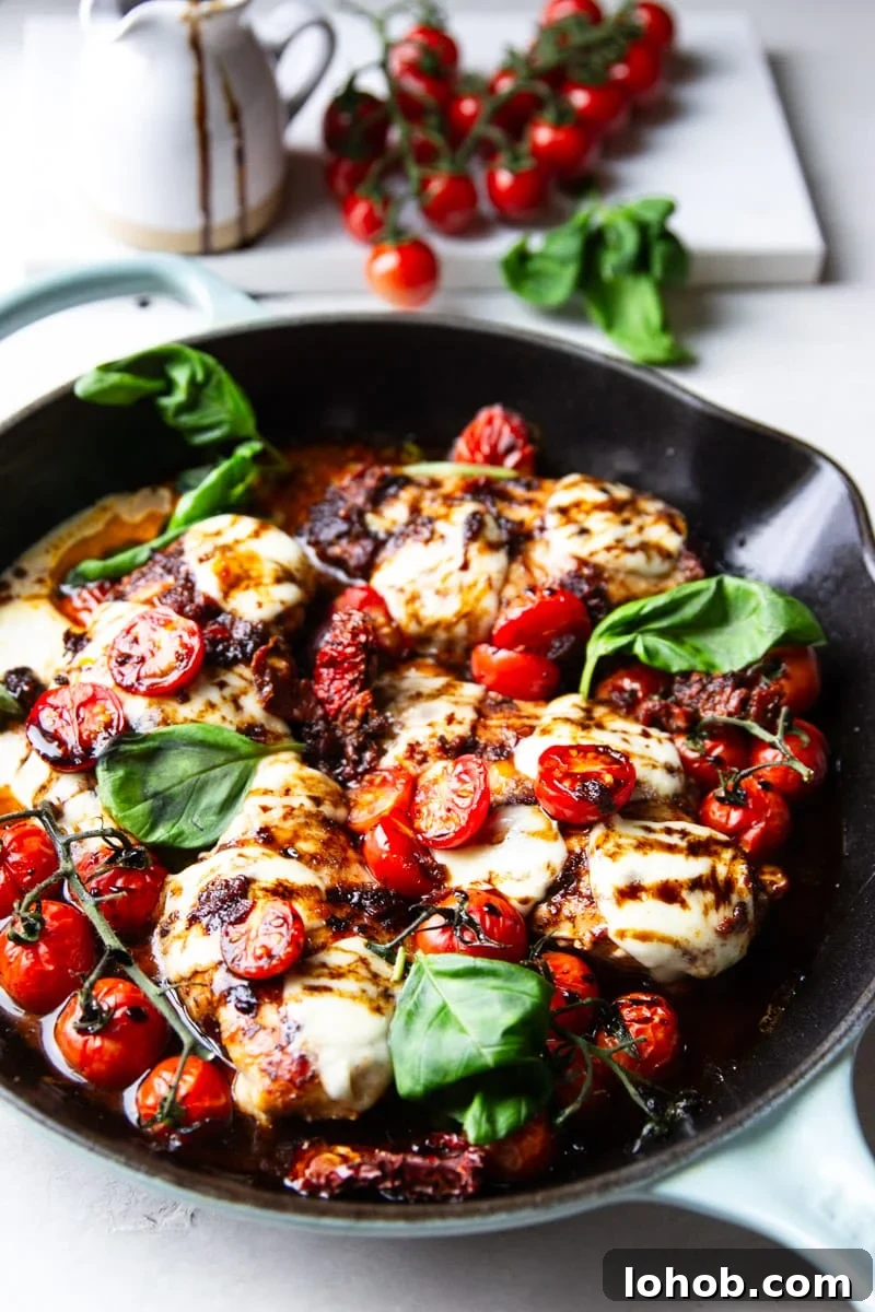 Sun-Dried Tomato Chicken Caprese Recipe with Balsamic Glaze 10 Cast iron skillet with balsamic glazed chicken, tomatoes, fresh mozzarella and basil.