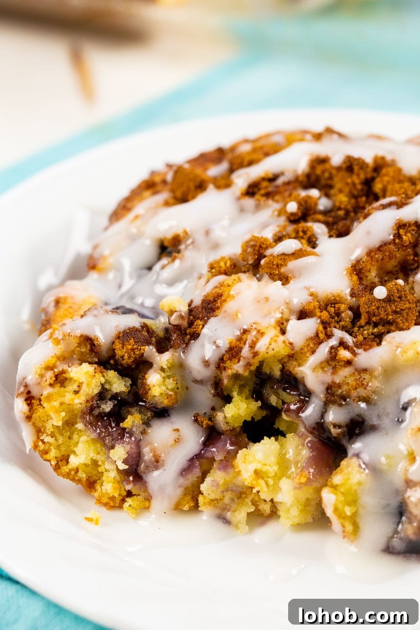 Slice of Blueberry Coffee Cake with glaze.