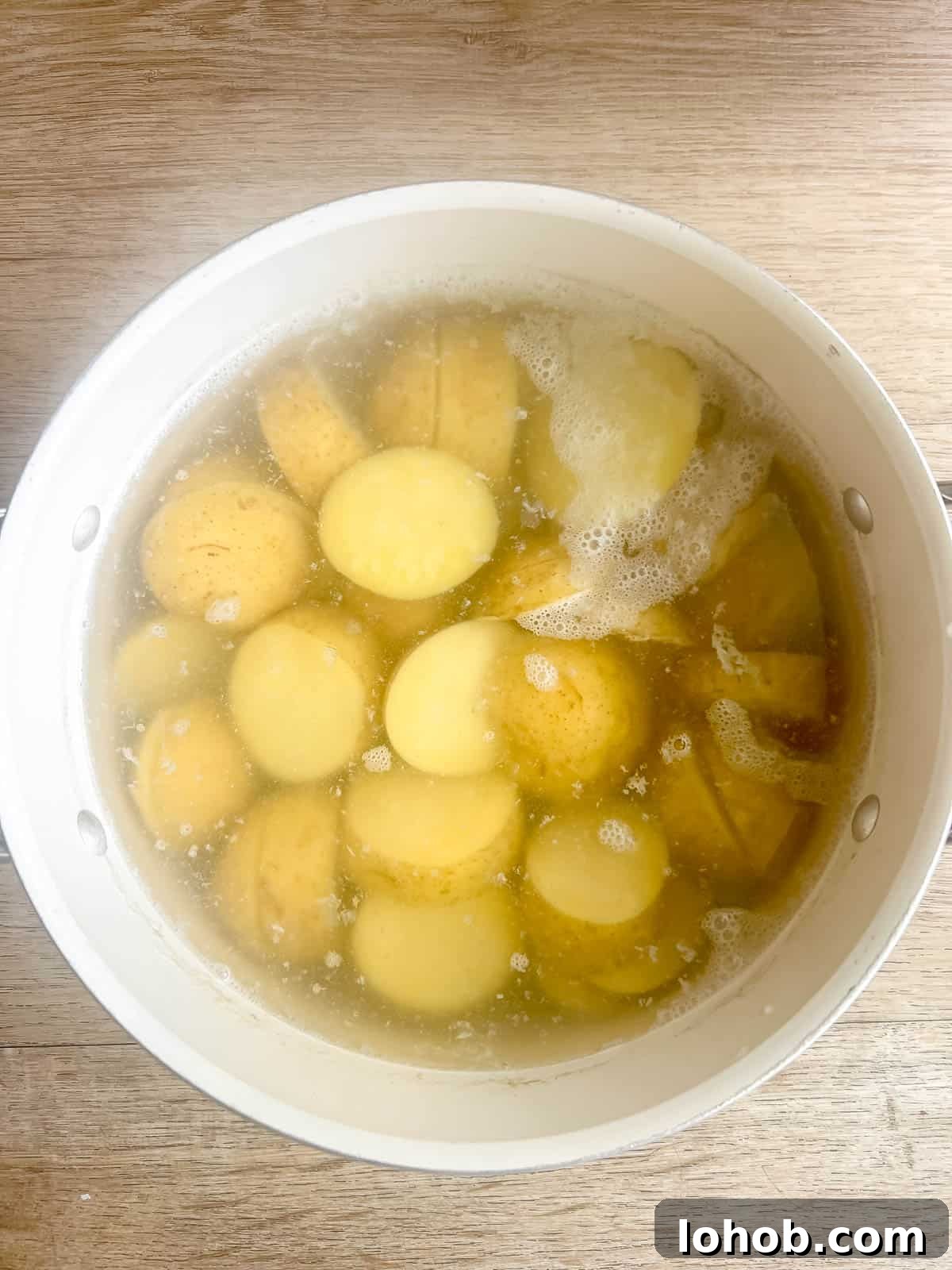 Potatoes in a pan boiling.
