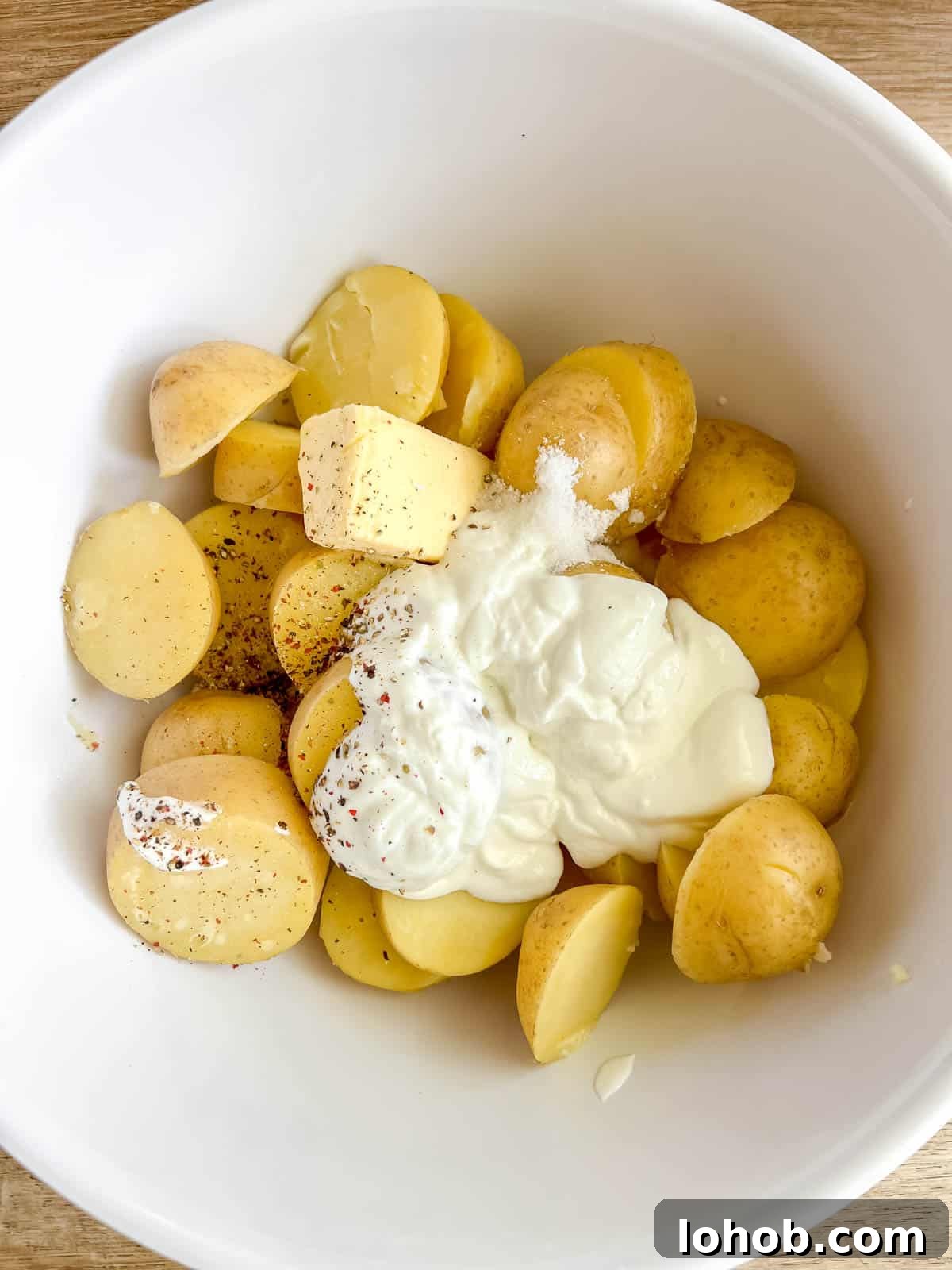 Greek yogurt, butter and milk on top of potatoes.