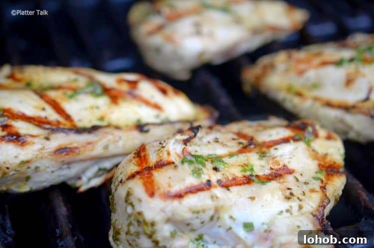 Grilled Chicken with Fresh Avocado Salsa Recipe 4 Chicken breasts on a hot grill.