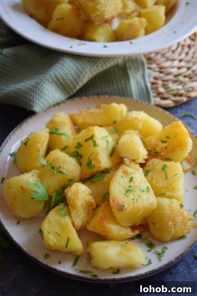 15 Irresistible Potato Recipes for Weeknight Meals 9 Roasted potatoes on a plate.