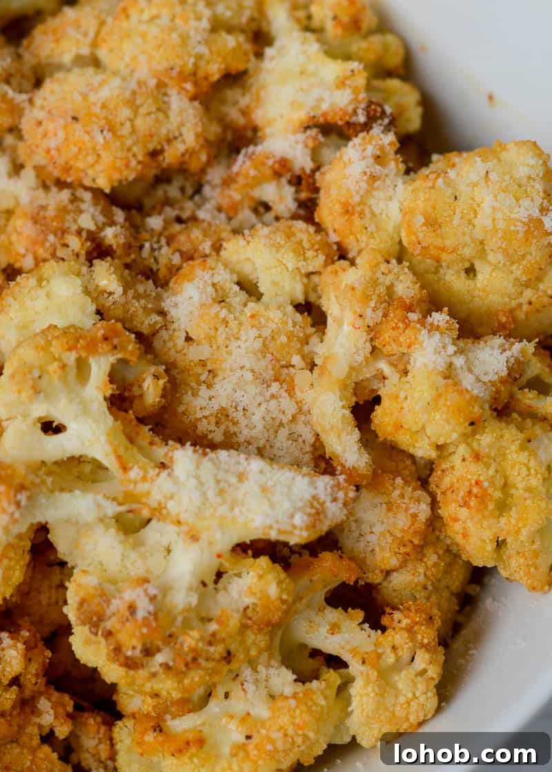 Close up of garlic parmesan cauliflower with crisped edges.