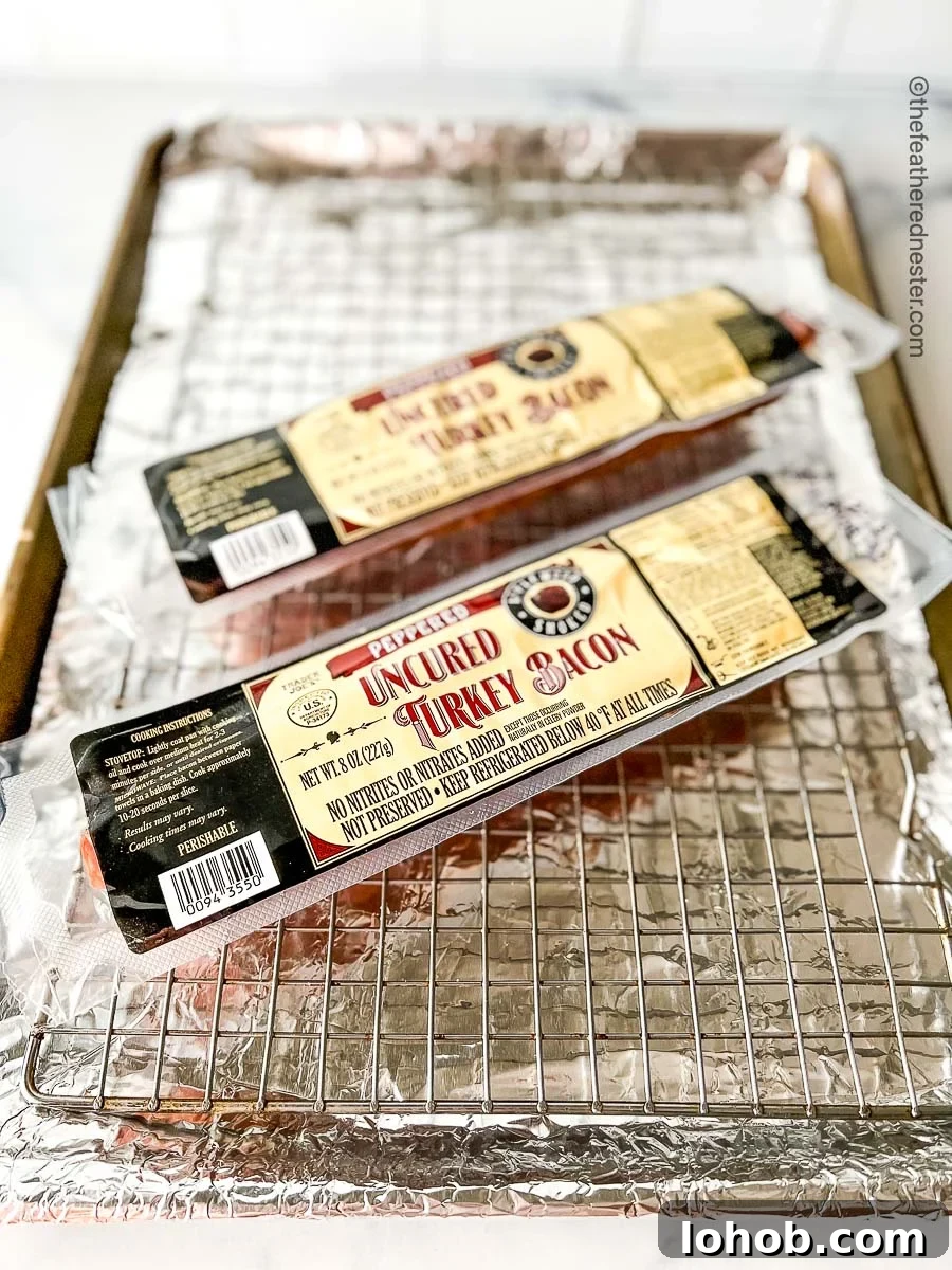 Bacon on a rack over a baking sheet lined in foil.