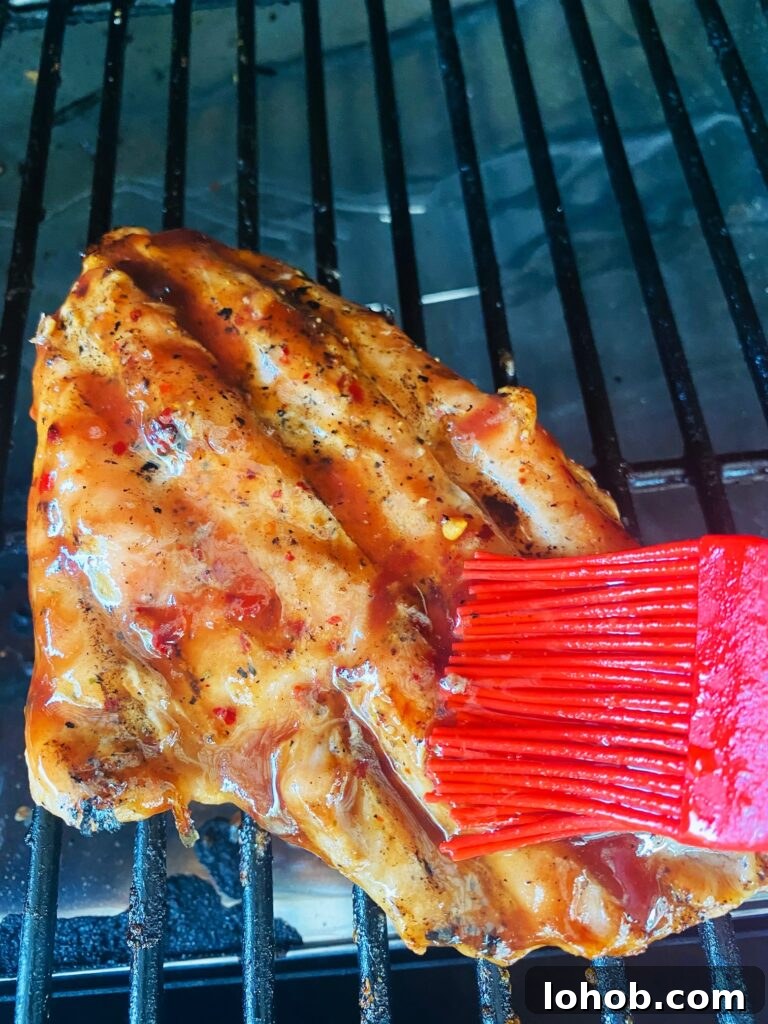 Citrus Cranberry Turkey Tenderloin with Orange Glaze 5 brushing turkey with the glaze