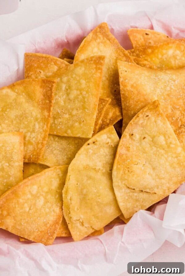 Crispy Air Fryer Green Beans with Garlic and Parmesan 10 Golden crispy tortilla chips stacked in a basket.