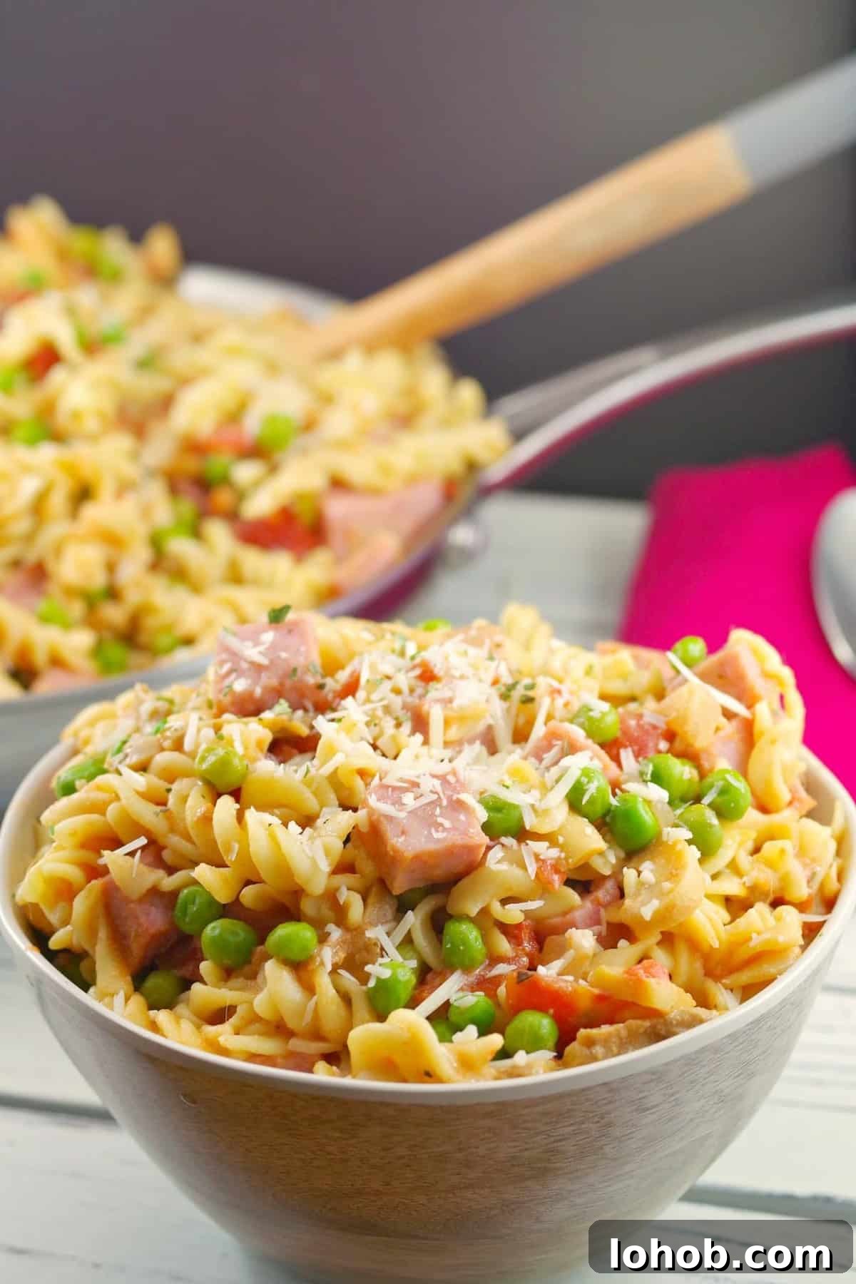 Leftover Ham and Pea Pasta Recipe for Quick Weeknight Meals 12 Leftover Ham Pasta in a bowl with a pan of more in the background