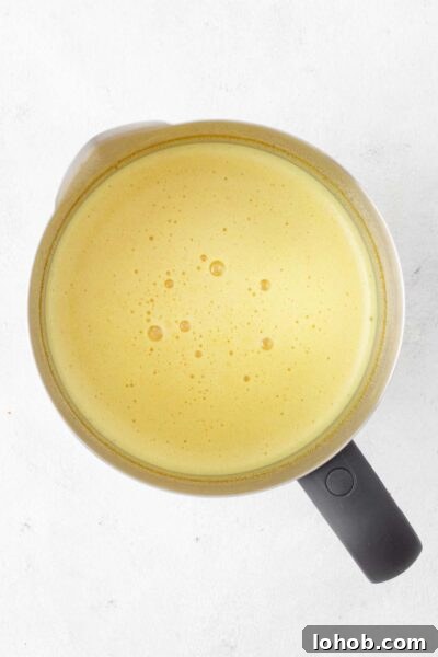 Golden milk in an electric milk frother.