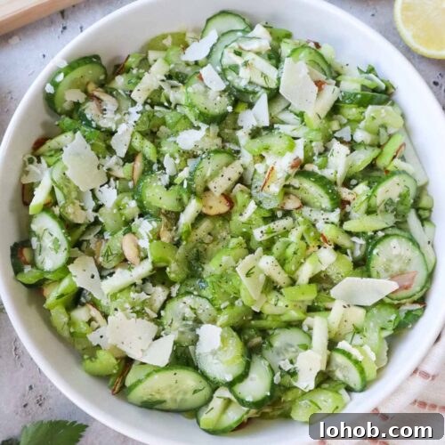 white bowl with celery cucumber salad.