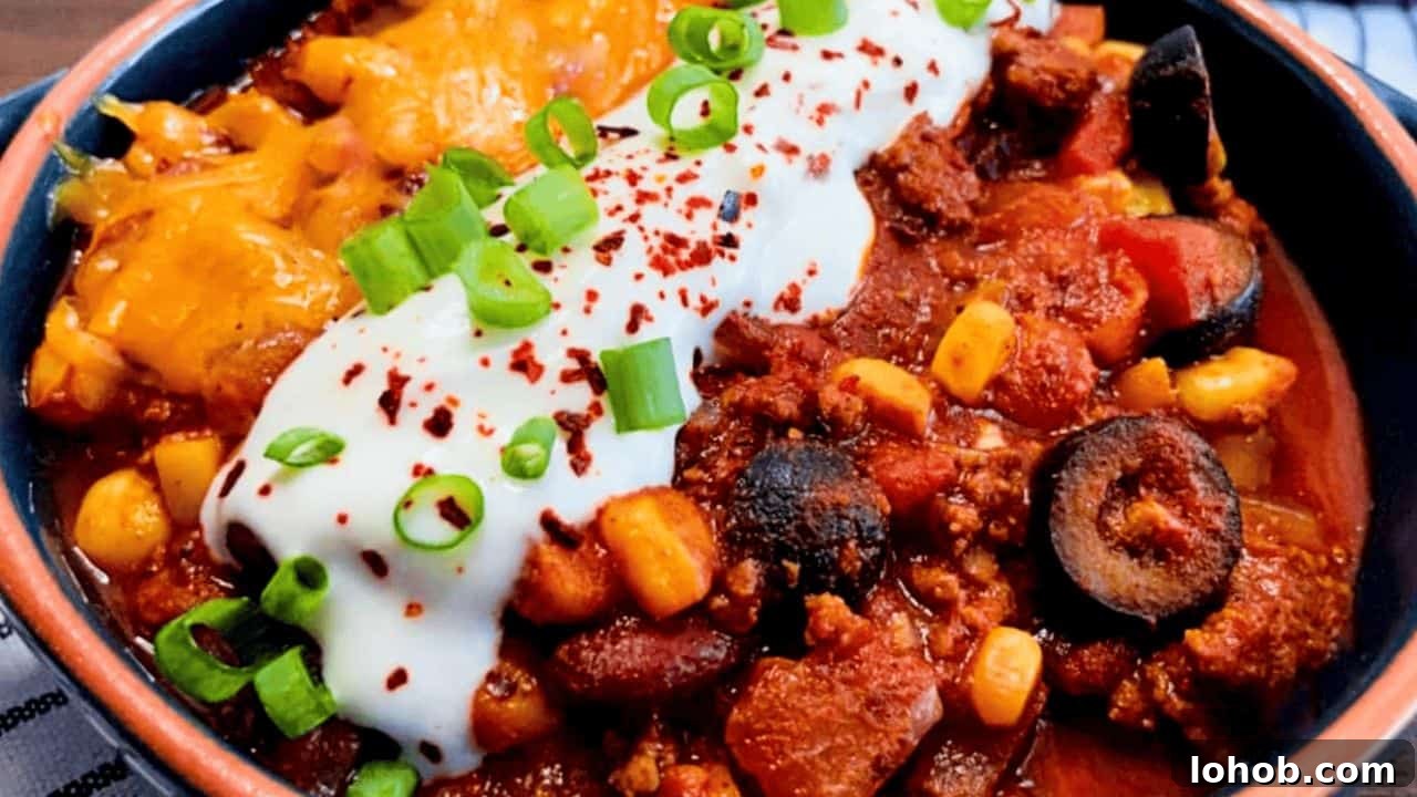 chili recipe in a brown and black bowl