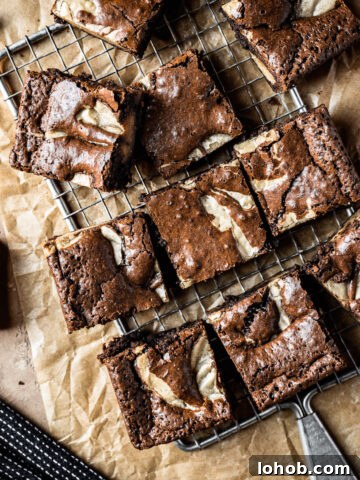 Brownie blondie squares casually arranged on a cooling rack.