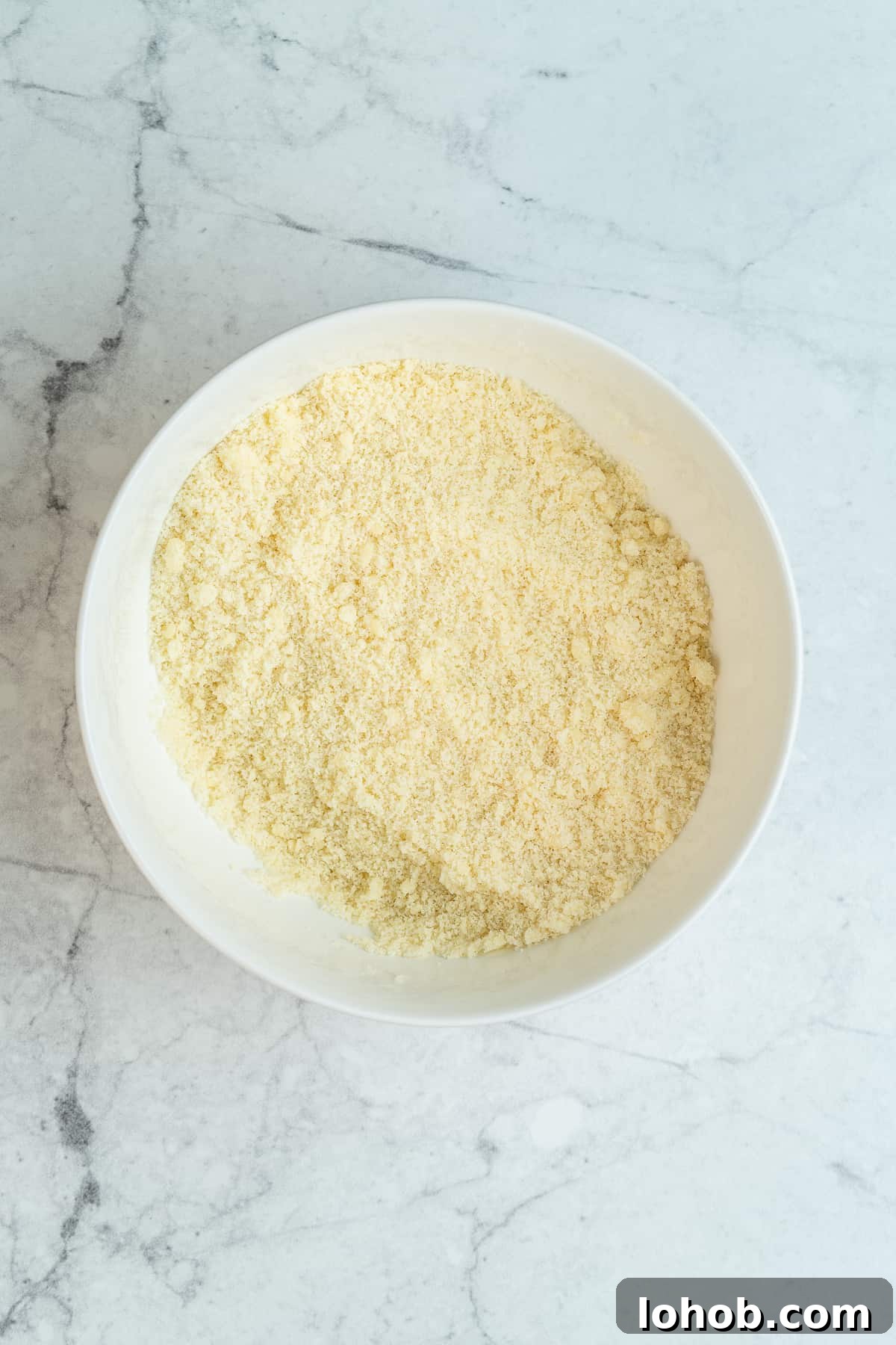 Sand-resembling butter mixture in a bowl.