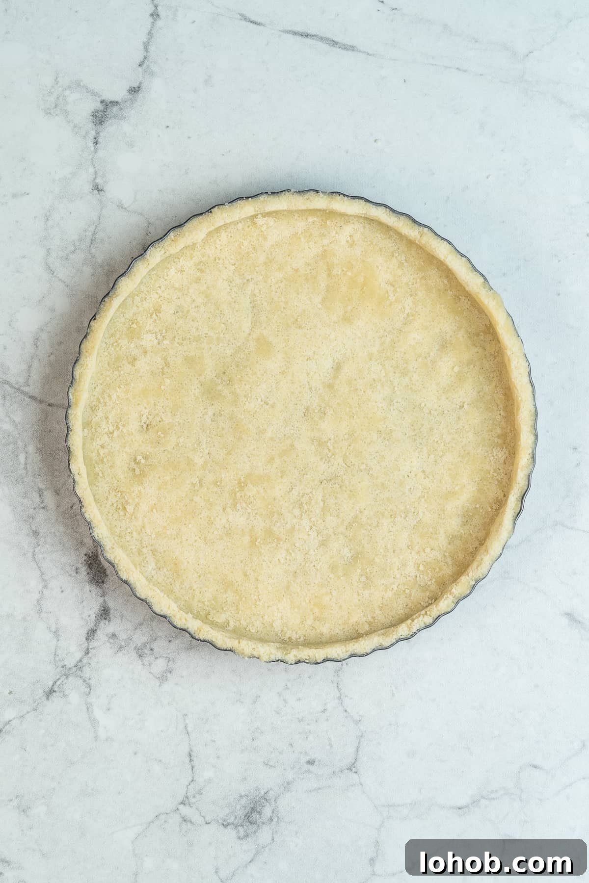 Tart dough into a tart pan.