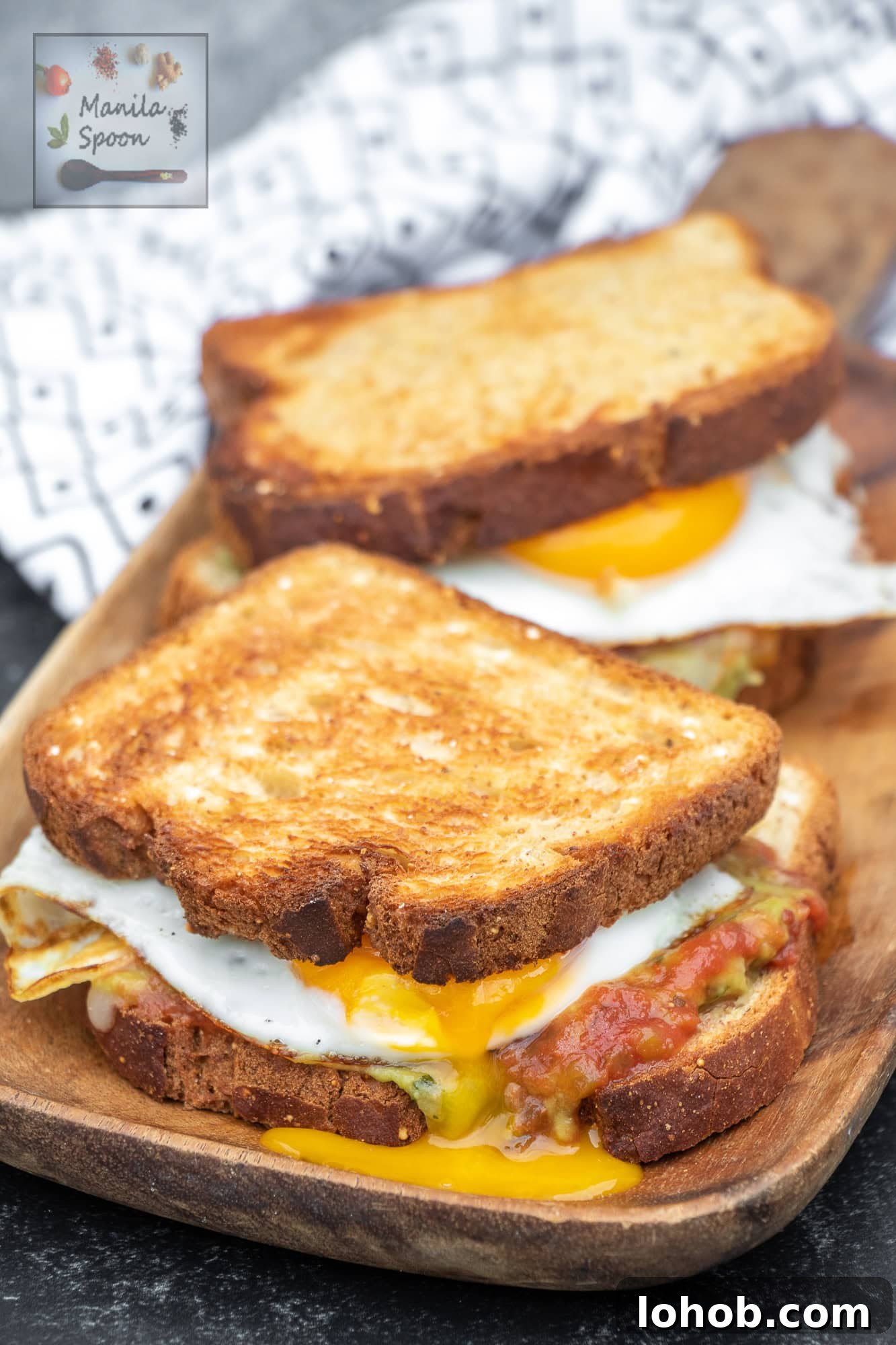 Guacamole, Salsa & Egg Breakfast Sandwich Recipe 3 Assembled guacamole and egg sandwich