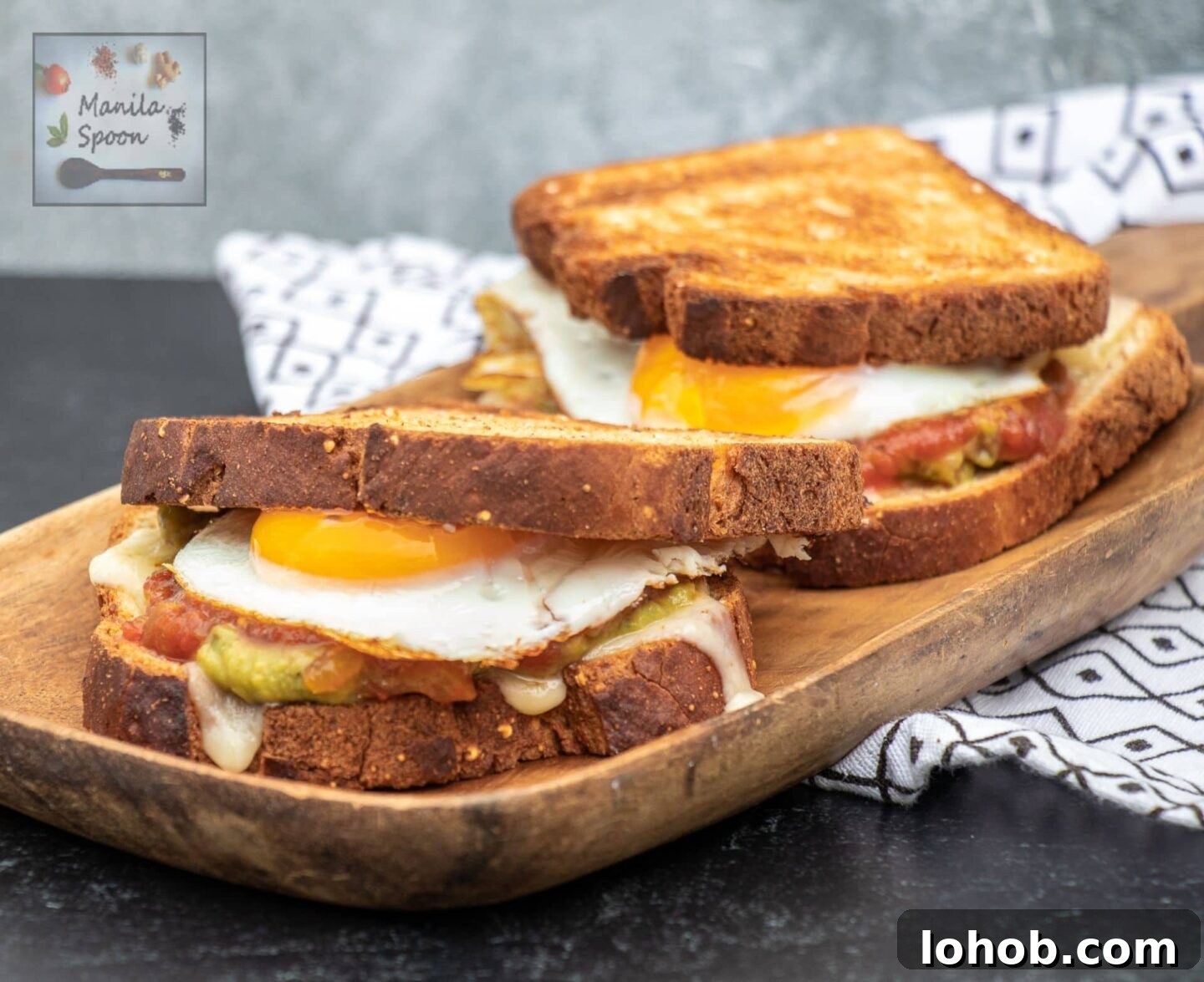 Guacamole, Salsa & Egg Breakfast Sandwich Recipe 8 Stacked breakfast sandwich