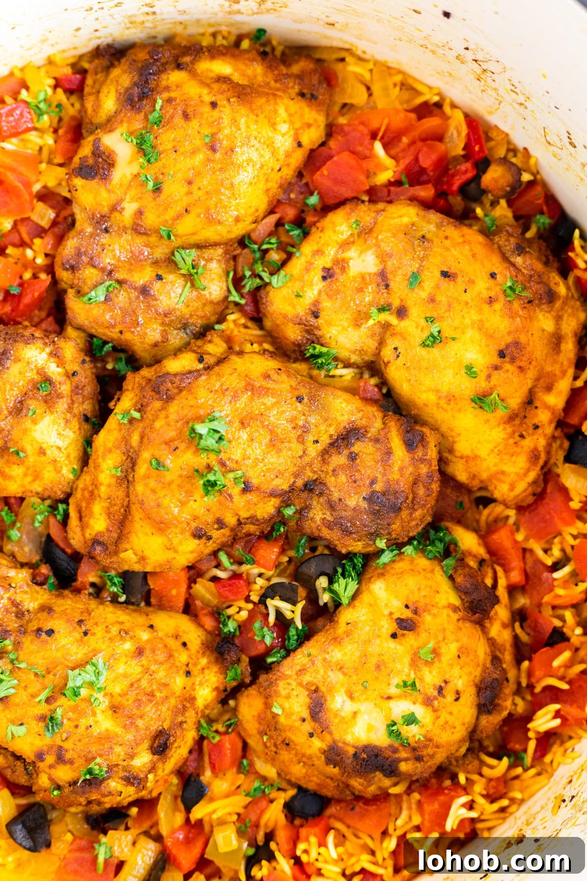 Authentic Spanish Chicken and Rice Recipe for Flavorful Dinner 2 Spanish chicken and rice inside a Dutch oven.