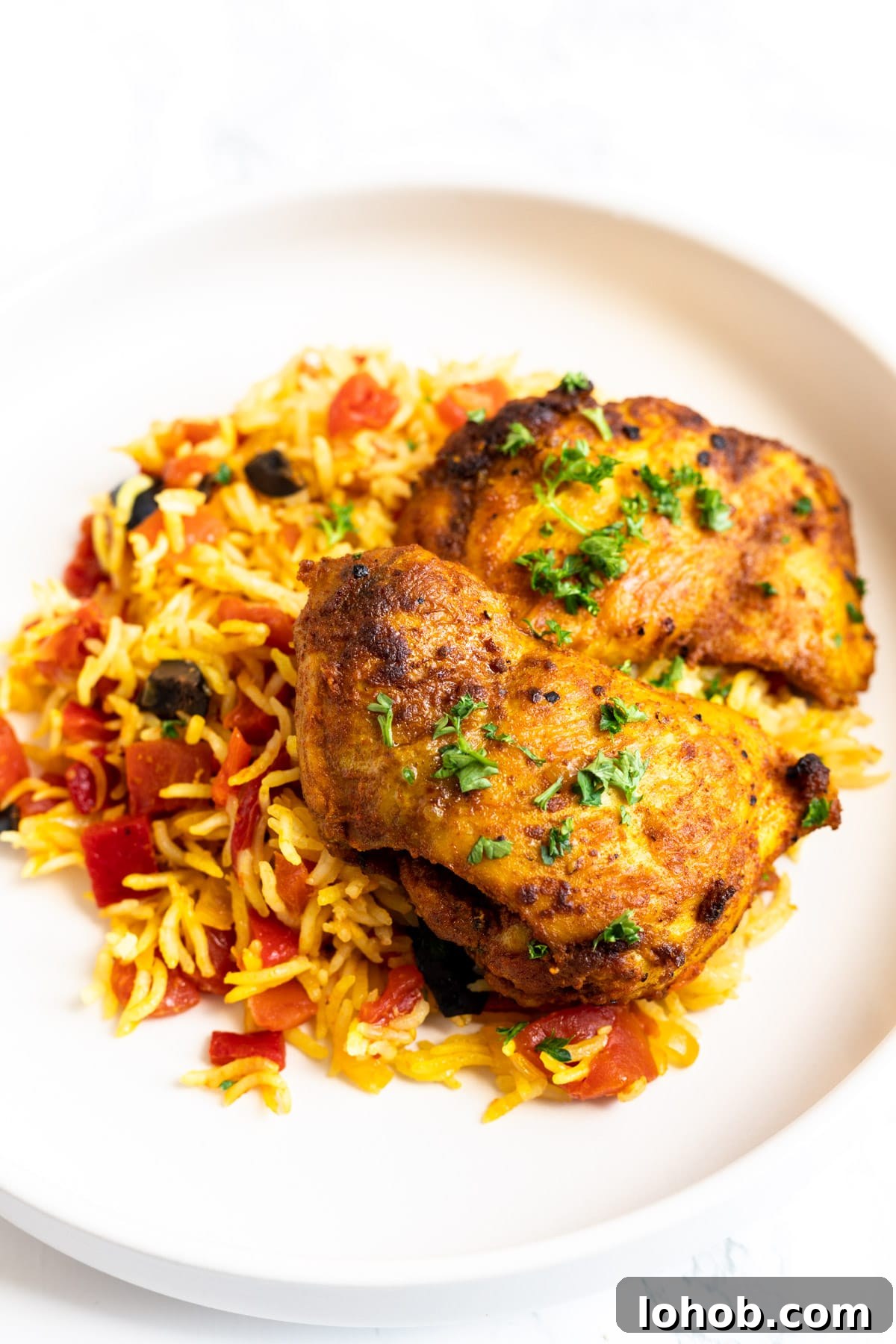 Authentic Spanish Chicken and Rice Recipe for Flavorful Dinner 7 Spanish chicken and rice served on a plate.