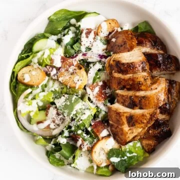 a top down view of balsamic chicken caesar salad