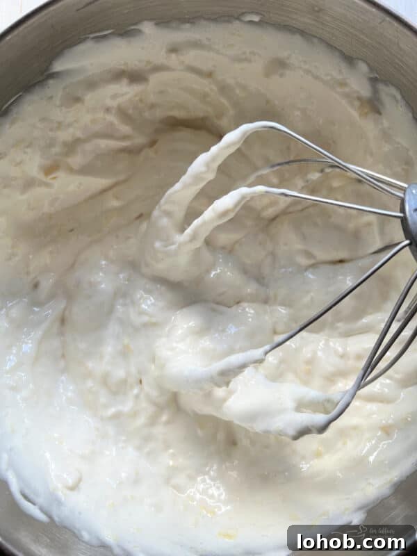 Two-Ingredient Pineapple Angel Food Cake Recipe 7 Pouring batter