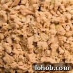 streusel topped Dutch apple pie in a pie dish.