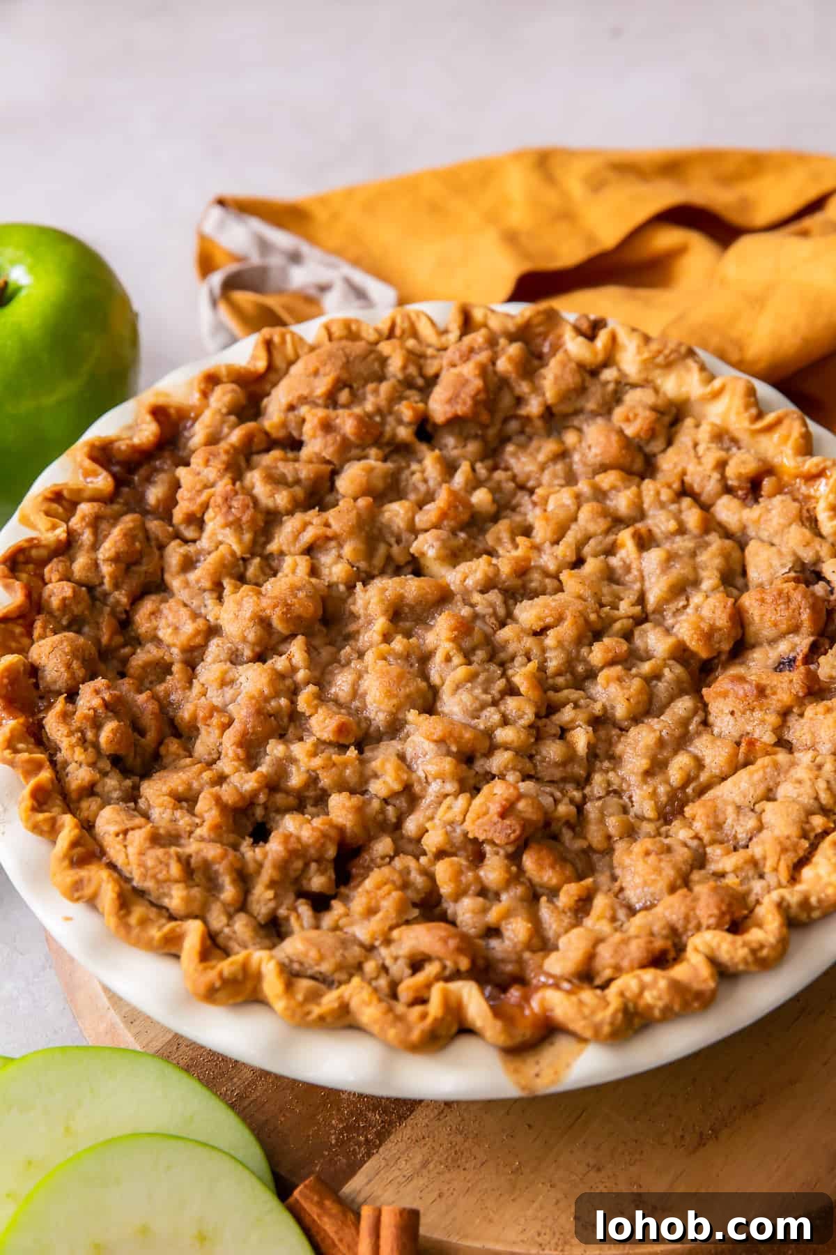 A whole dutch apple pie with streusel topping.