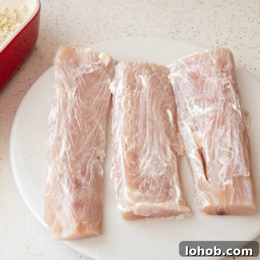air fryer mahi mahi cooking step 1 - Coat filets with mayonaise
