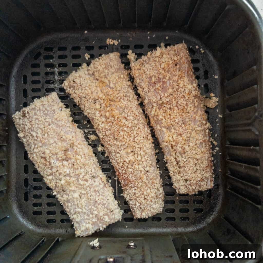 Air fryer mahi-mahi breaded and ready to cook in air fryer basket step 3