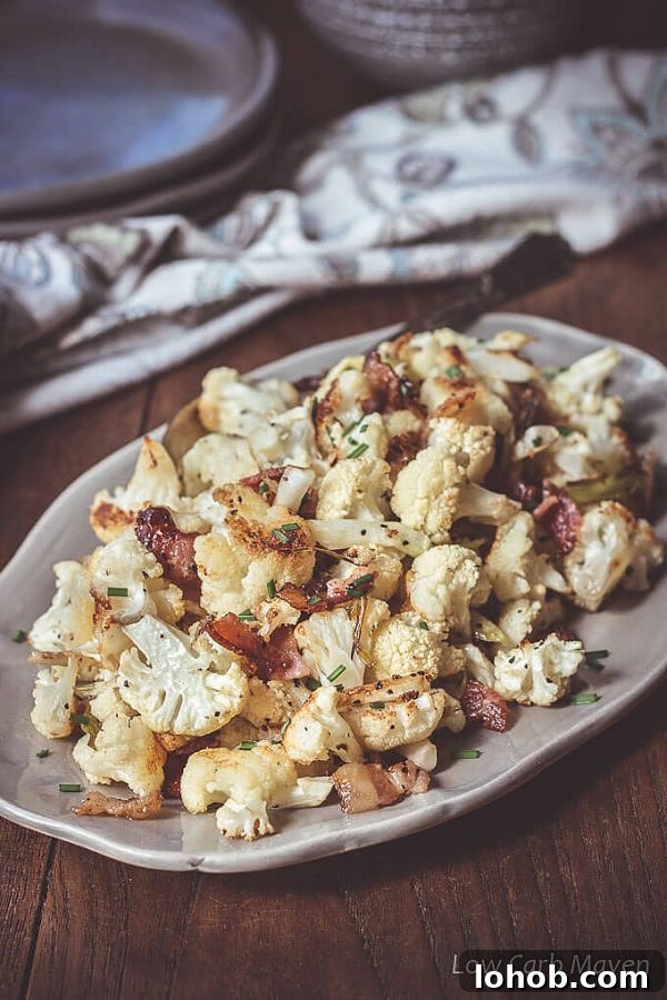 Crispy Roasted Cauliflower with Bacon and Green Onions 2 Cauliflower roasted with bacon and green onions on an oval platter.