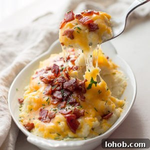 Crispy Roasted Cauliflower with Bacon and Green Onions 6 Low carb loaded cauliflower with sour cream, chives, cheddar cheese and bacon. Keto.