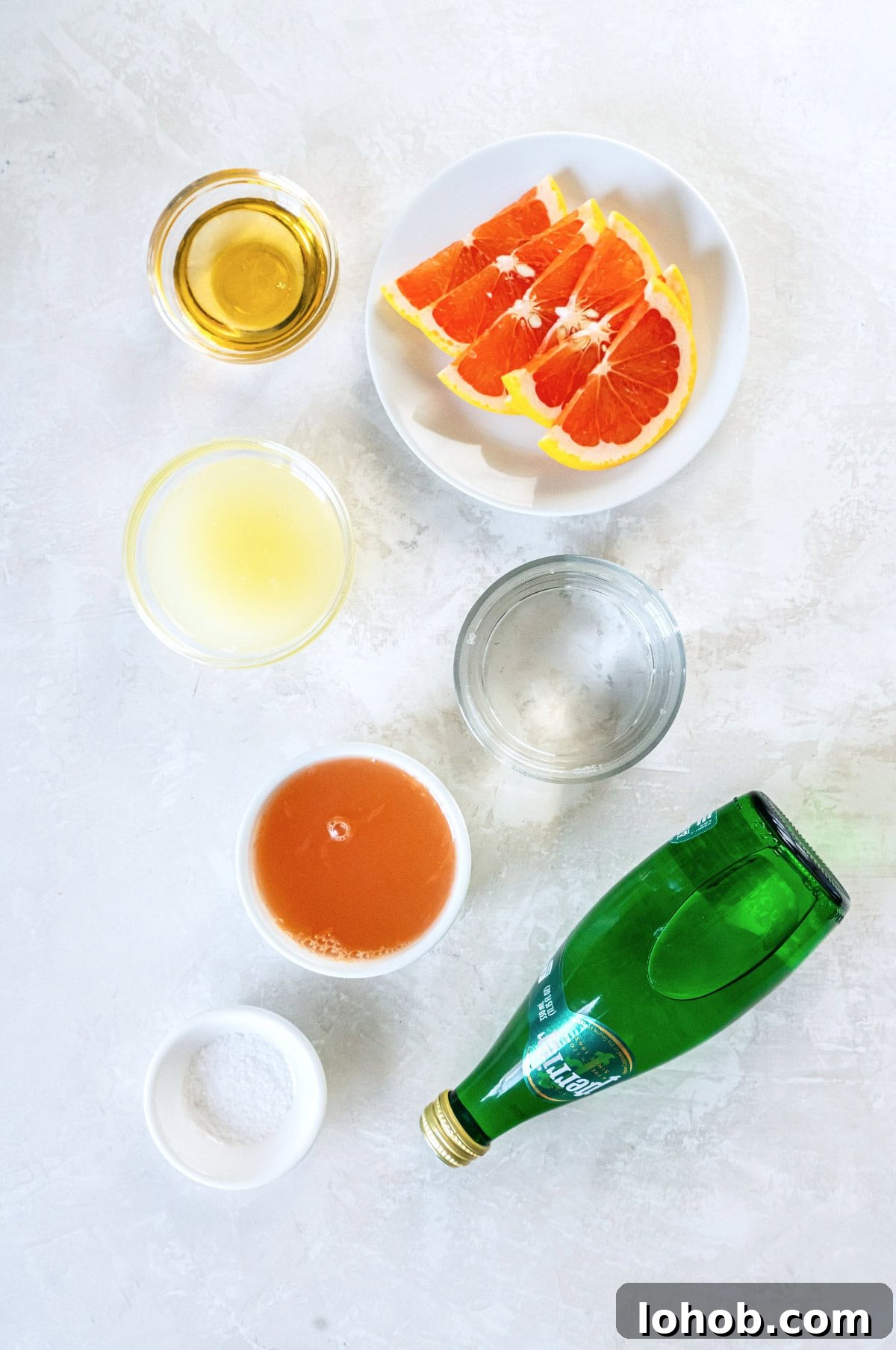 ingredients for a grapefruit paloma sitting on a counter.