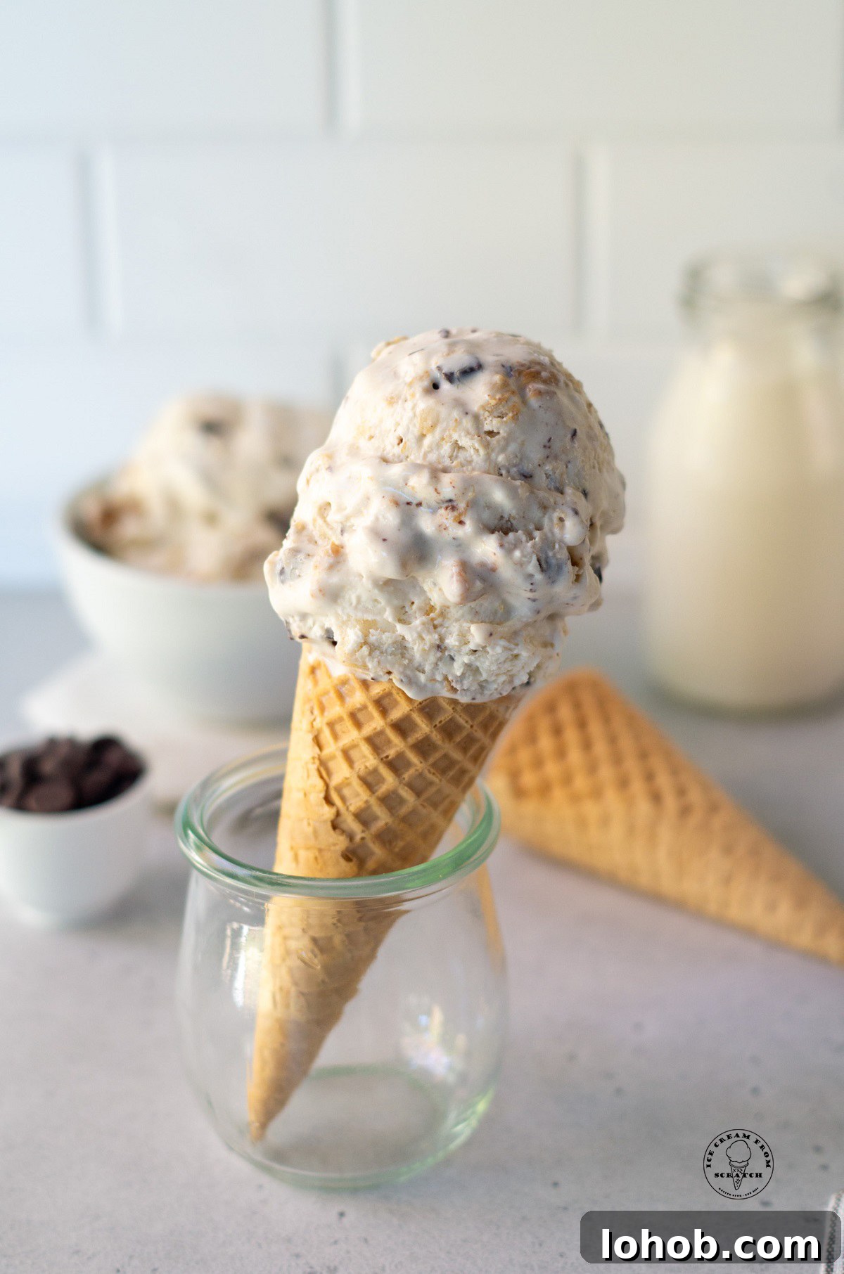 a sugar cone topped with scoops of homemade fat elvis ice cream