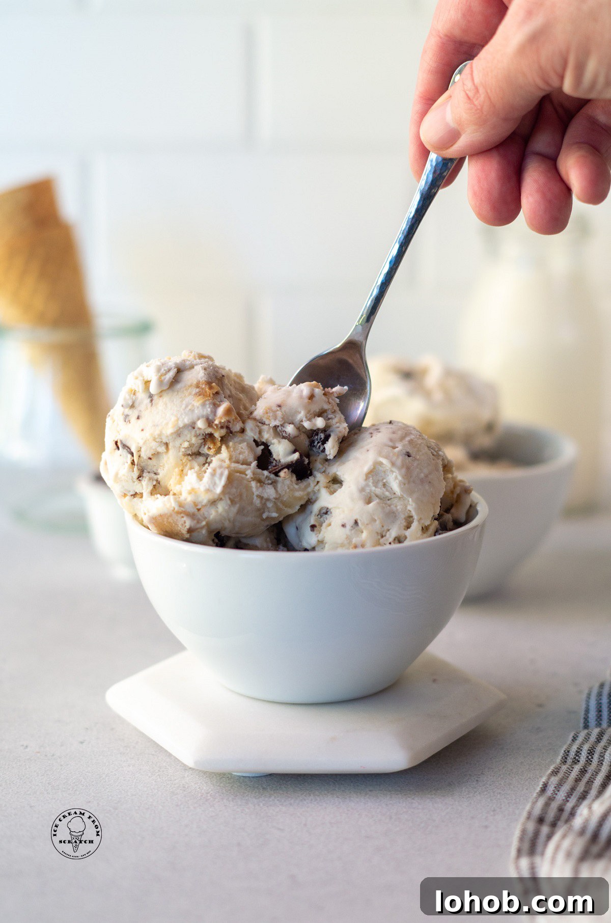 a bowl filled with scoops of peanut butter banana fat elvis ice cream.