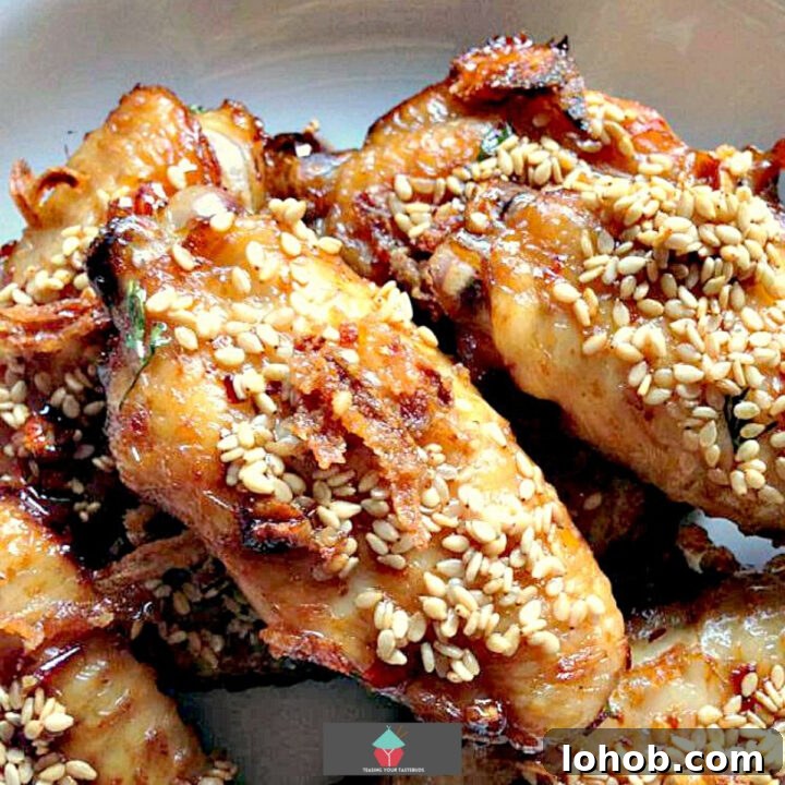 Spicy Brown Sugared Chicken Wings. Deliciously baked wings, coated in brown sugar, baked onions and spices then coated in sesame seeds. Perfect party food!