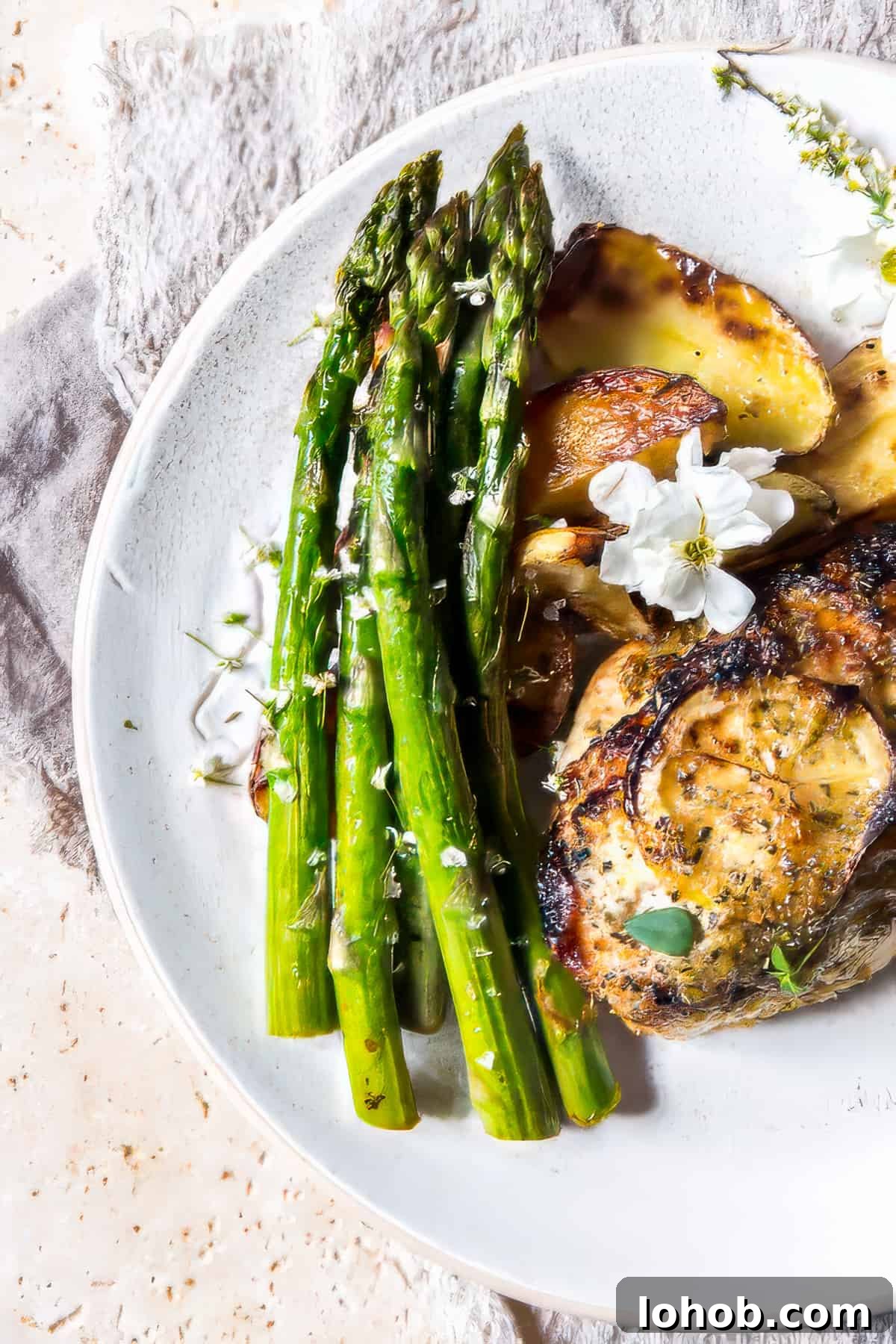 Sheet pan chicken and potatoes with lemon and herbs.