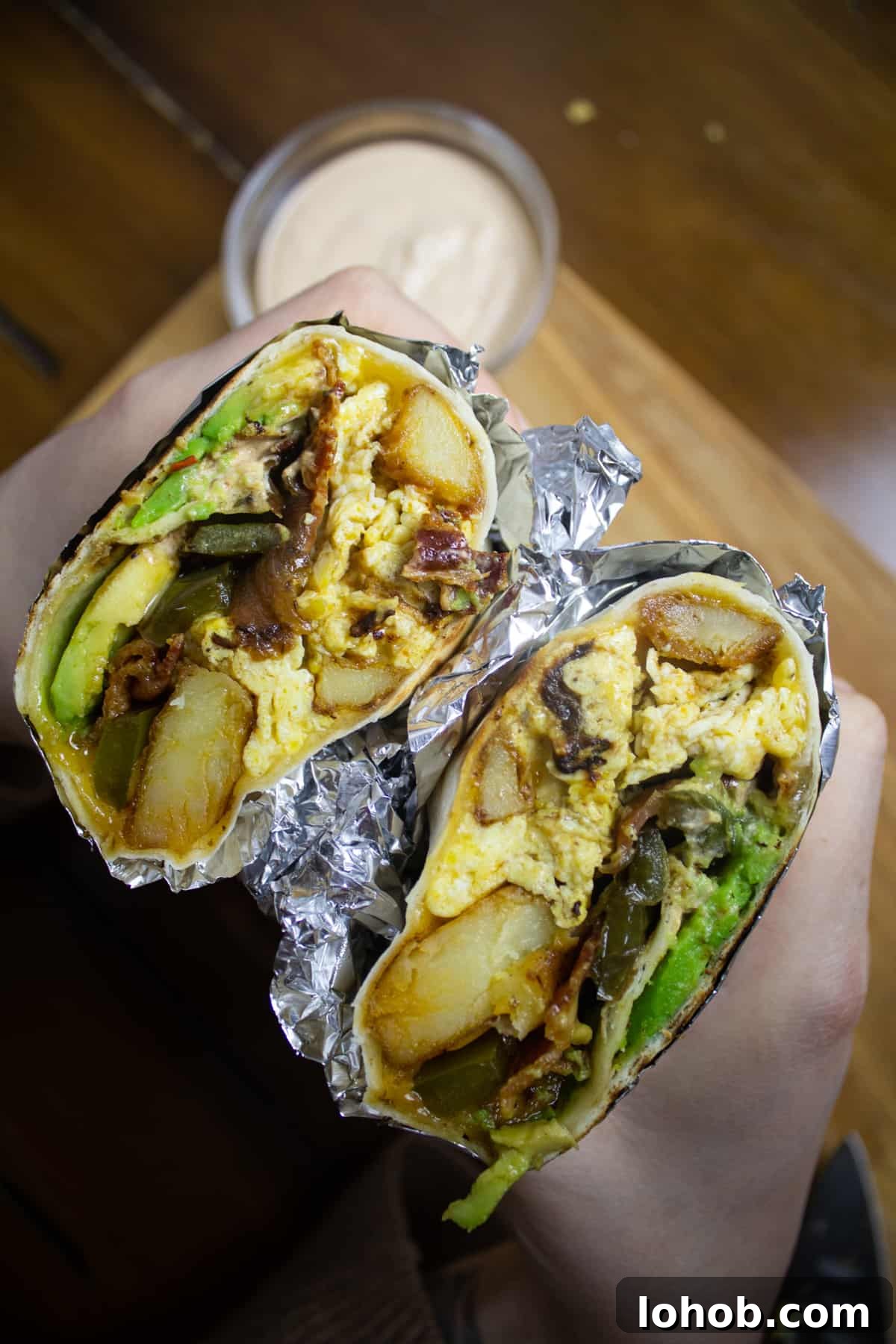 Southwest Potato Breakfast Burrito Recipe with Salsa Verde 2 Peppers, potatoes, bacon, egg, and cheese burrito
