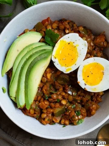 eggs and lentils for breakfast with sliced avocado