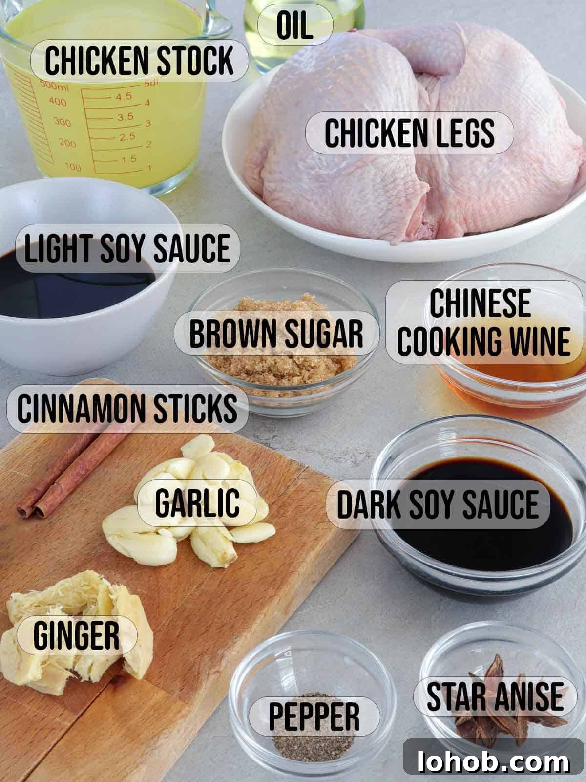 Crispy Soy-Glazed Chicken Recipe for Crunchy, Savory Skin 3 chicken, garlic, onion, brown sugar, dark soy sauce, light soy sauce, Chinese cooking wine, chicken stock, star anise, cinnamon sticks in bowls.