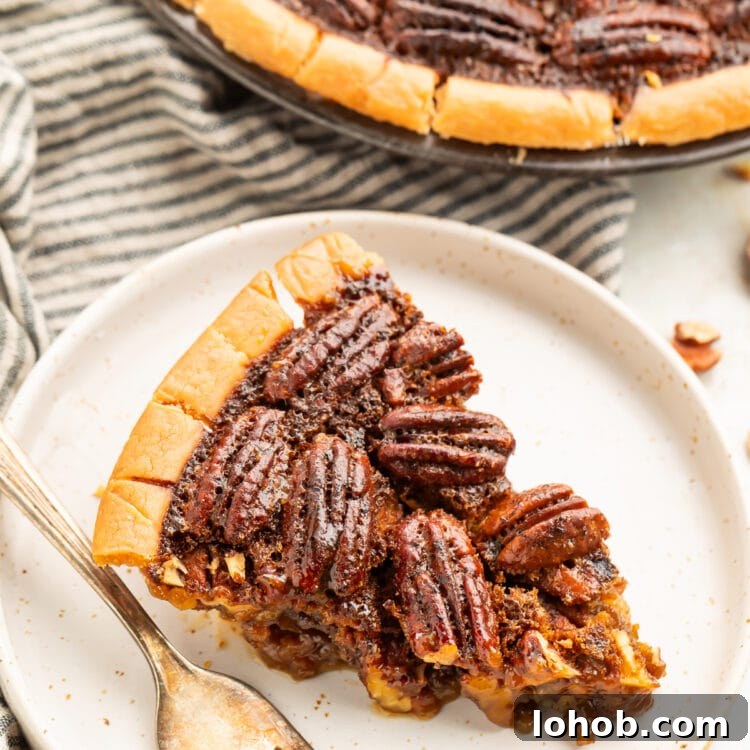 Pecan Pie Without Gluten: Classic Recipe for a Flaky Crust 4 A wedge slice of gluten free pecan pie on a plate next to the remaining pie in a pie plate.
