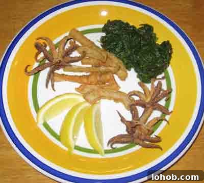 Crispy Greek Fried Calamari (Kalamarakia Tiganita) 3 Fried calamari with greens