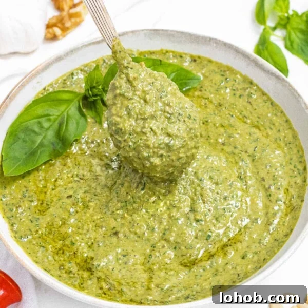 Kale Pesto Recipe: Vibrant Sauce for Pasta, Sandwiches & More 11 Basil Pesto with spoon