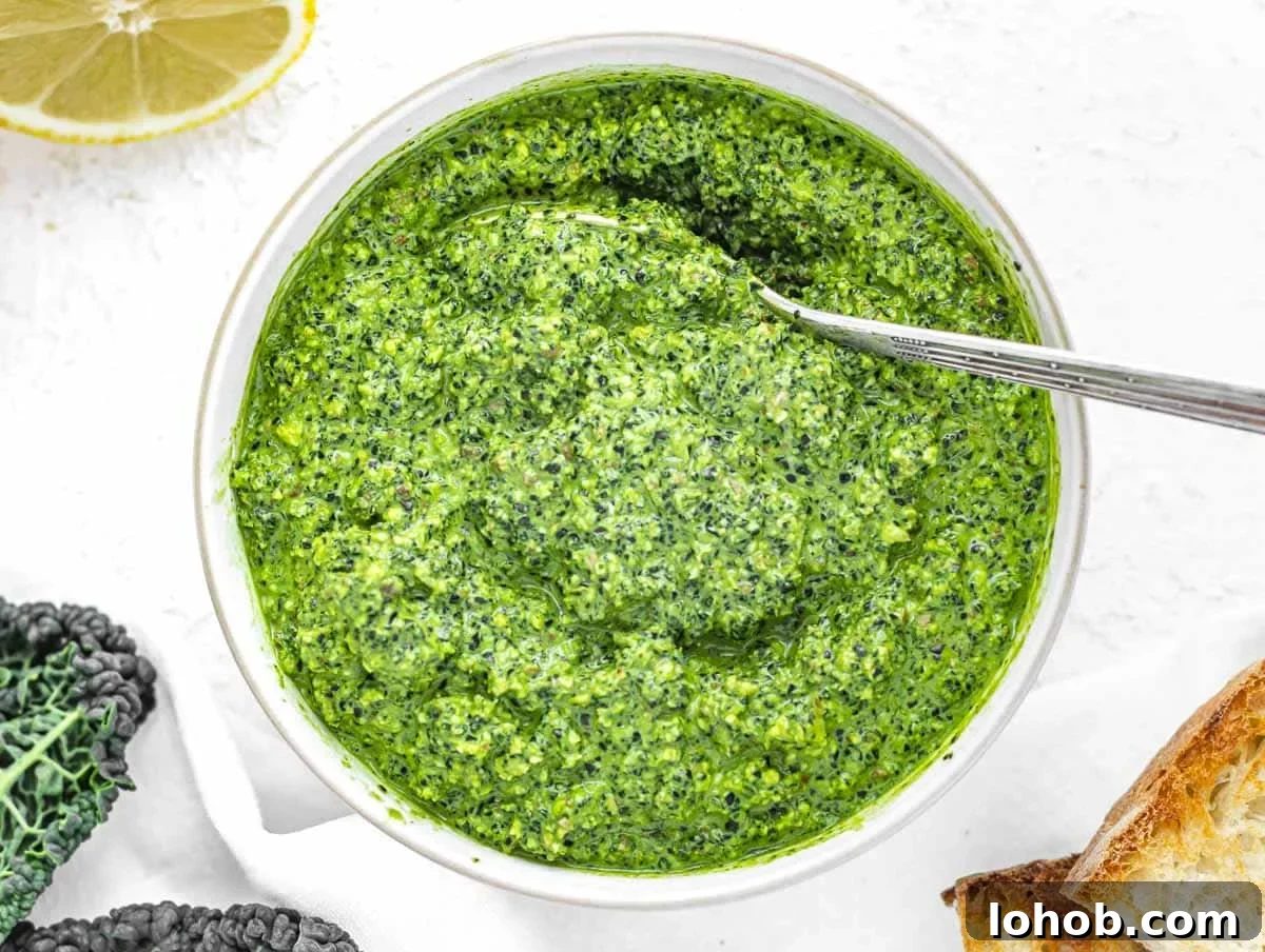Kale Pesto Recipe: Vibrant Sauce for Pasta, Sandwiches & More 8 Kale Pesto with silver spoon