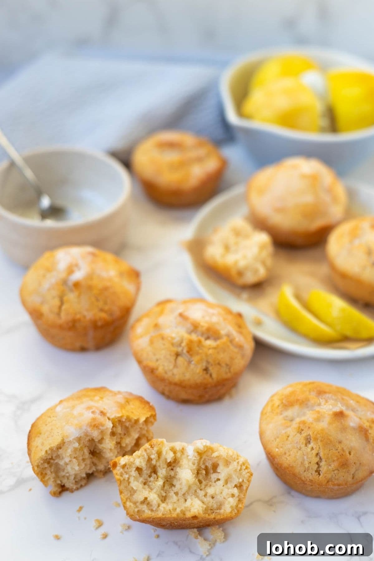 Quick Sourdough Lemon Muffins Recipe for Fresh Morning Bakes 3 Sourdough lemon muffin broken open to show the soft crumb inside.
