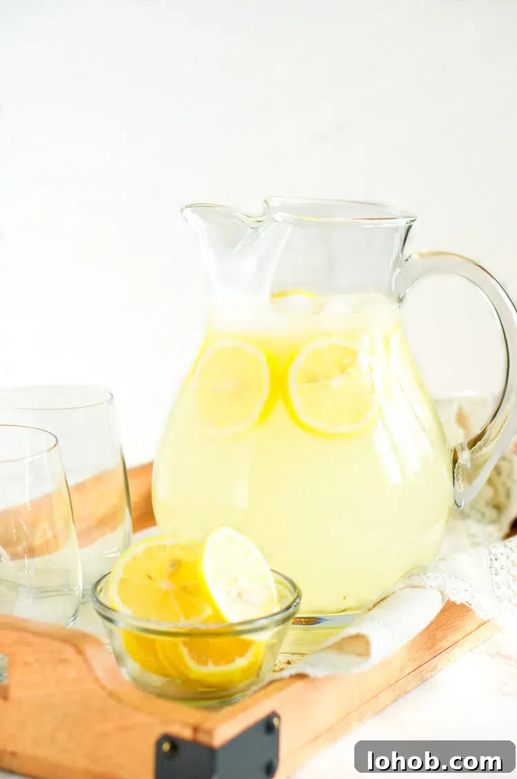 Refreshing Homemade Lemonade Recipe for Perfect Summer Sips 6 homemade lemonade in a glass pitcher with lemons