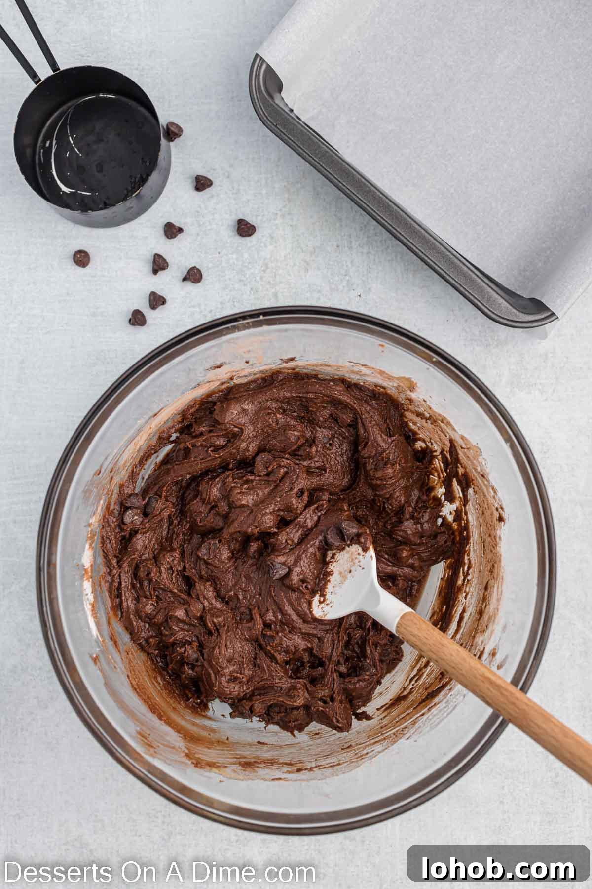 Fudgy Oreo Brownies Recipe with Creamy Cookie Filling 5 Dry ingredients added to butter mixture.