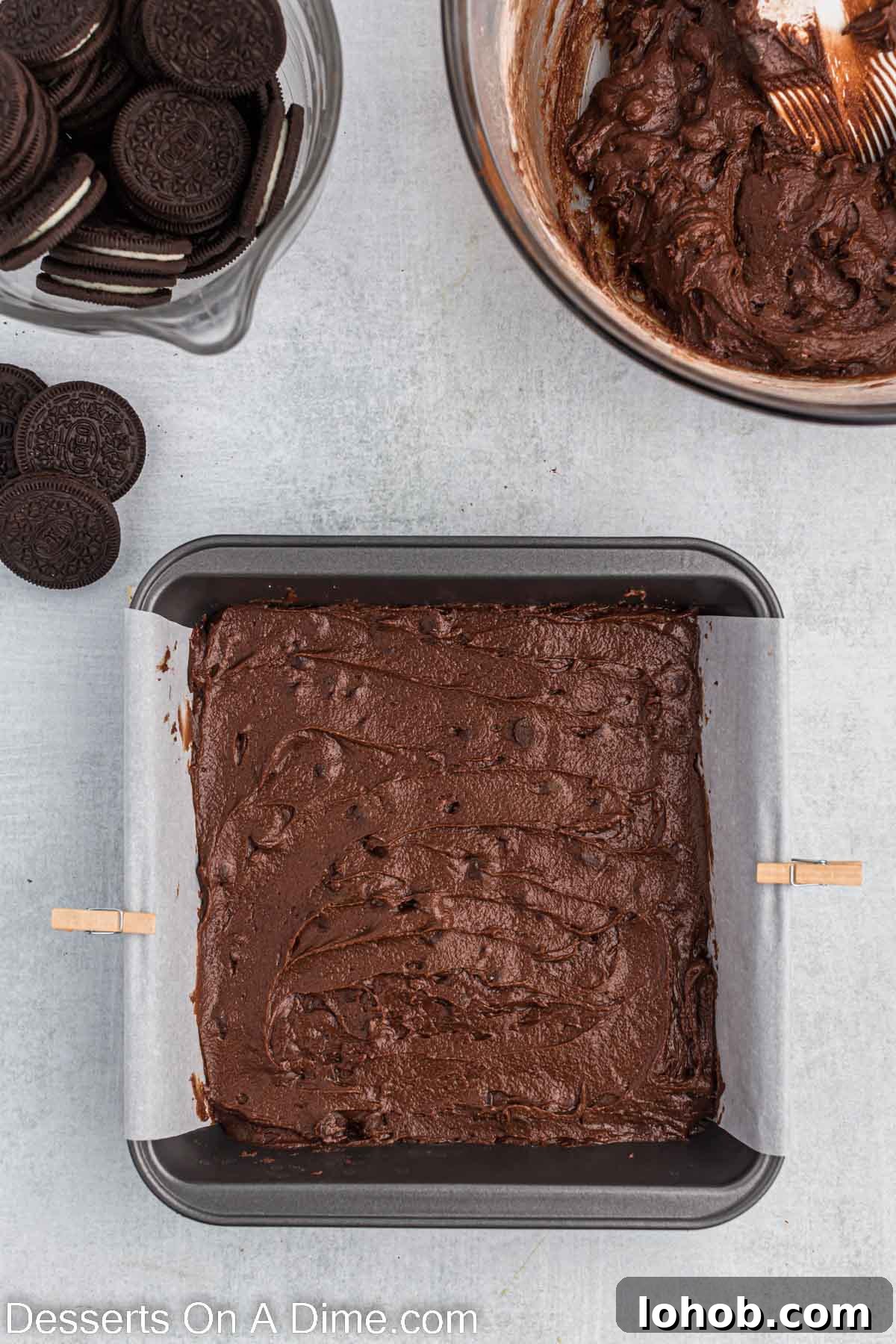 Fudgy Oreo Brownies Recipe with Creamy Cookie Filling 6 Batter poured into baking dish.